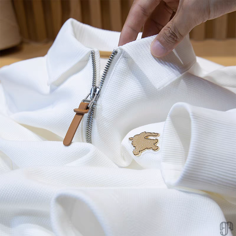 Embellished with a distinctive golden rabbit emblem on the chest