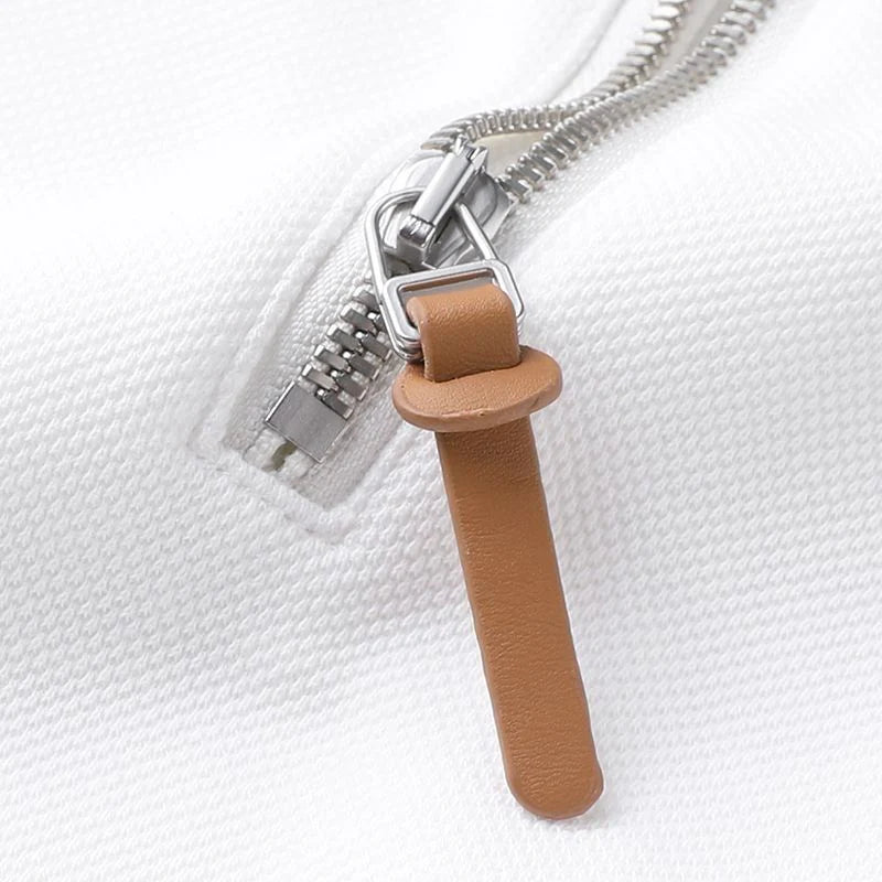 Embellished with a distinctive golden rabbit emblem on the chest